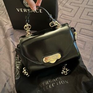 Versace Vintage black patent leather top handle,gold chain. Excellent condition.